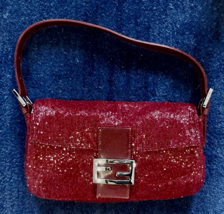 Red beaded Fendi baguette handbag.