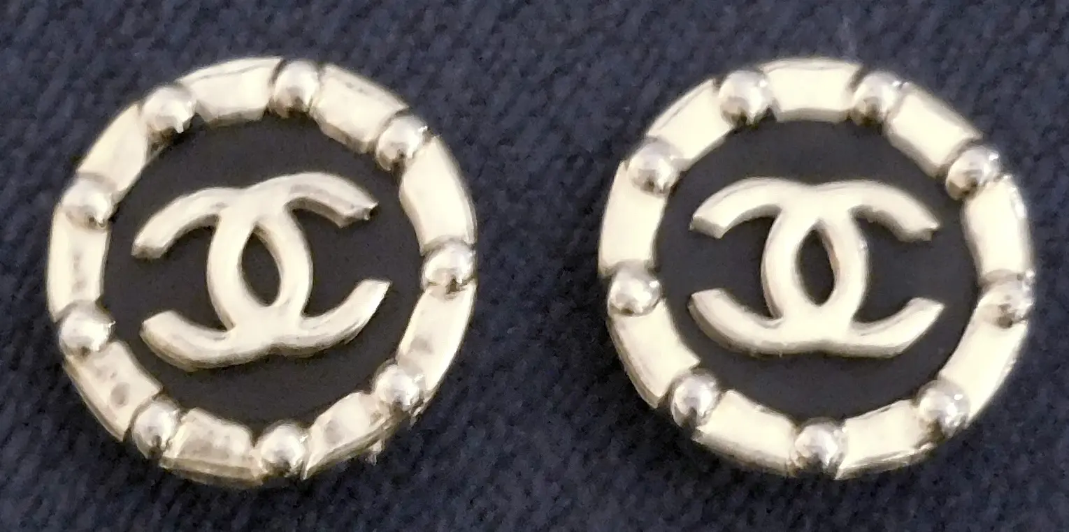 Pair of gold Chanel logo earrings.